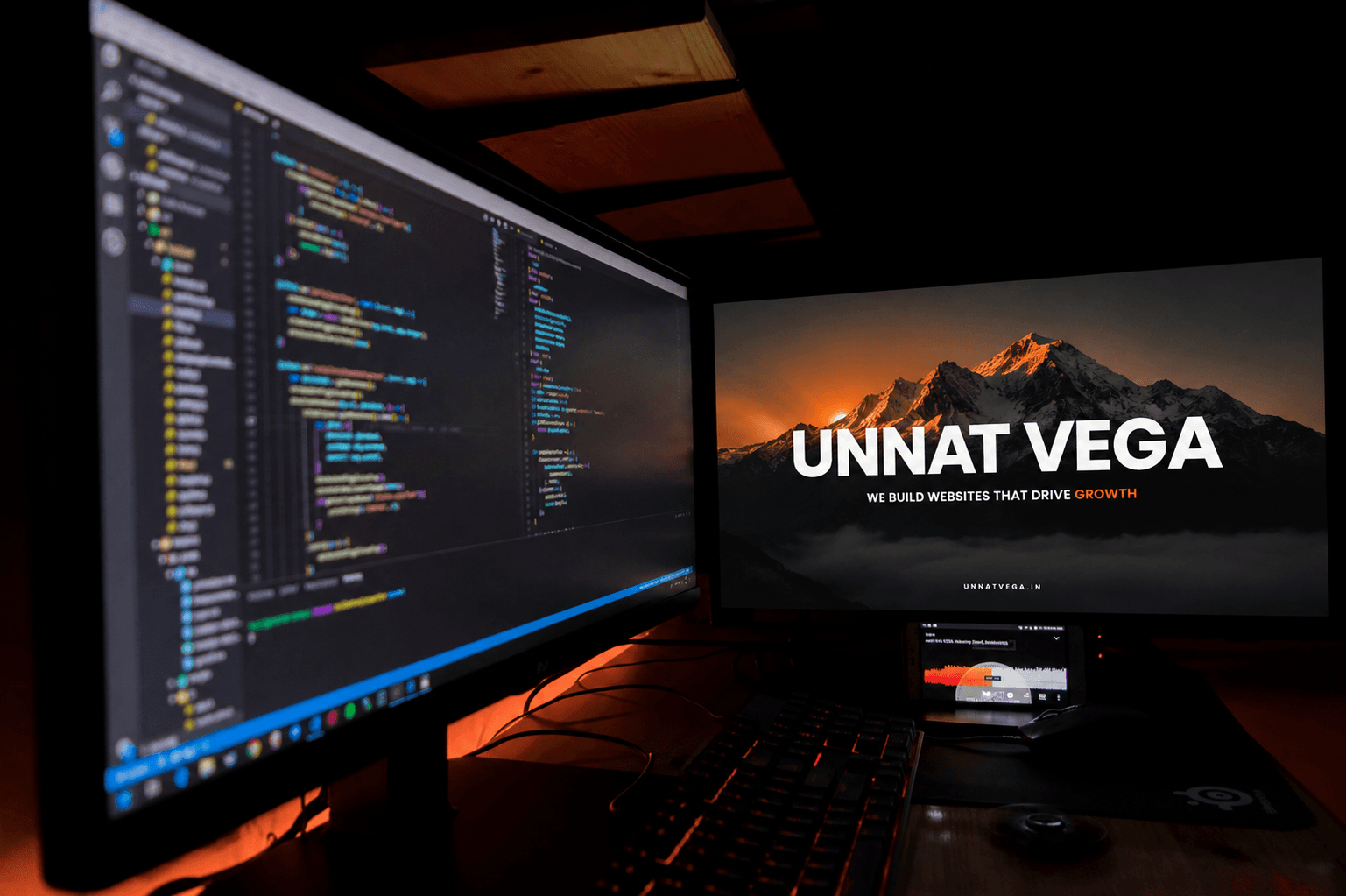 Website design showing coding and a brand - Unnat Vega